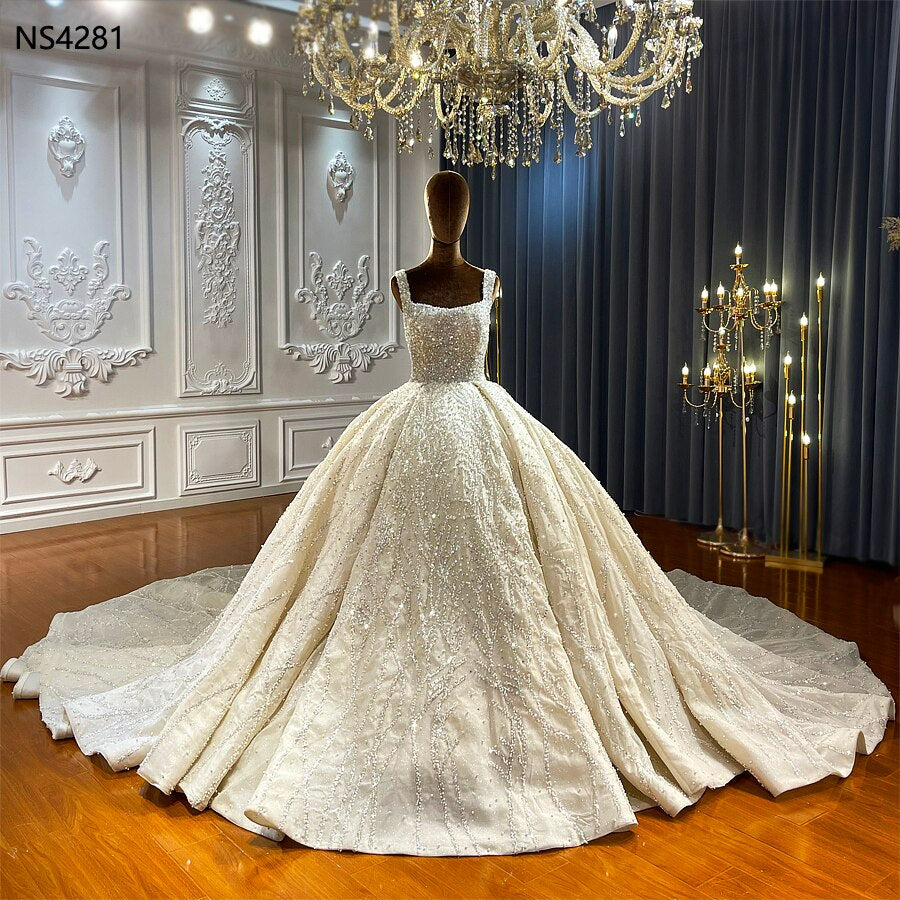 Spaghetti strap shimmery luxury ball gown wedding dress