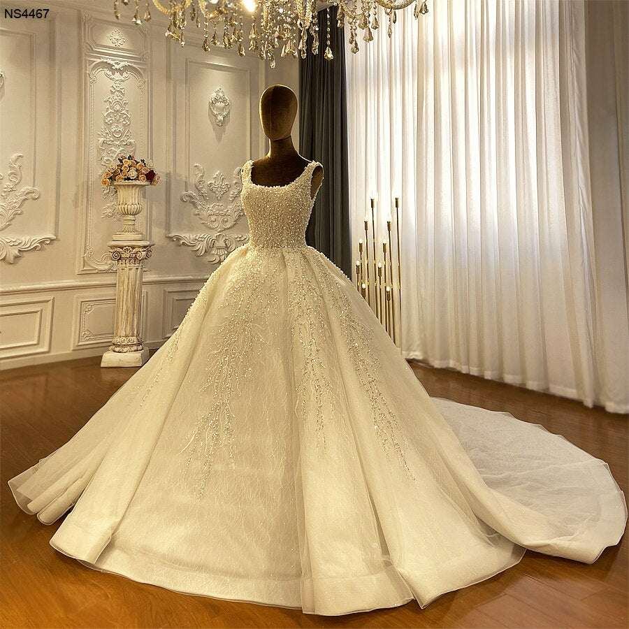 Full pearl beaded spaghetti ball gown luxury wedding dress