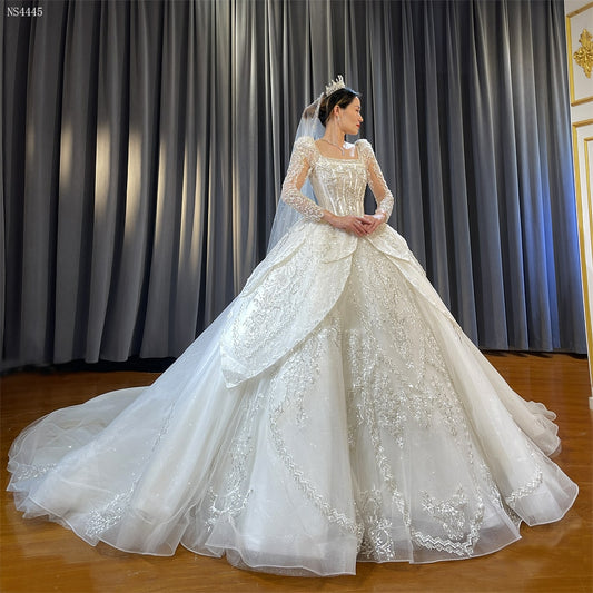 Long Sleeve shimmery flower petal style ball gown wedding dress